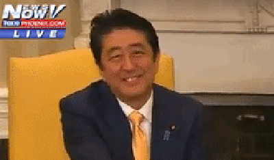 A gif of Japanese Prime Minister Abe after President Trump held their handshake for 30 seconds.