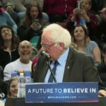 A bird lands on the lecturn while Bernie Sanders is speaking in Oregon.