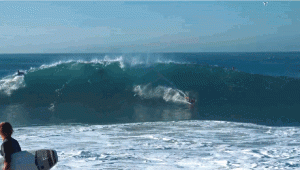 A boogie-boarder rides a wave at The Wedge in Newport Beach, California.