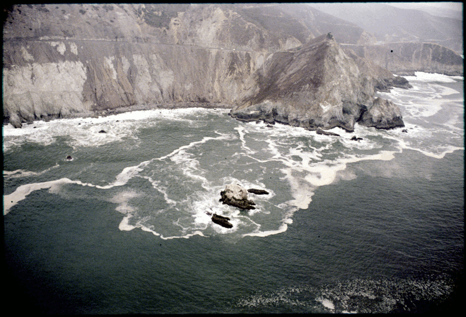 1979 archive photograph of Devil's Slide on former California Hwy 1 used as a background for a gif made with text from Nick Montfort’s dynamic poem generator