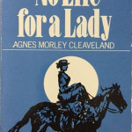 Book cover with full moon silhouetting a woman riding a horse on a side saddle.